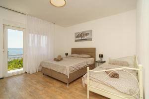 Postel nebo postele na pokoji v ubytování Blue Heaven Apartments