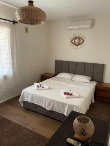 Postel nebo postele na pokoji v ubytování Xanthos Hotel Patara Ev + 10 fotografií