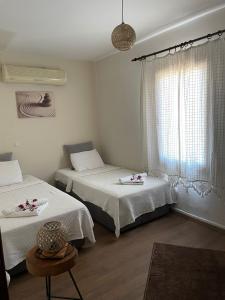 Postel nebo postele na pokoji v ubytování Xanthos Hotel Patara Ev