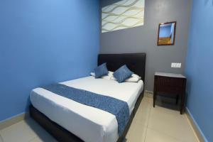 Postel nebo postele na pokoji v ubytování Hotel 3Winz, Chow Kit Hospital Kuala Lumpur