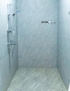 a bathroom with a shower with a tiled shower at Nature Kigali in Kigali +109 photos