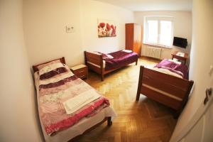 Posteľ alebo postele v izbe v ubytovaní Apartament Poznań Jeżyce