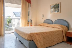 Postel nebo postele na pokoji v ubytování Hotel Venezia