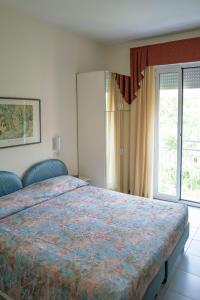 Postel nebo postele na pokoji v ubytování Hotel Venezia
