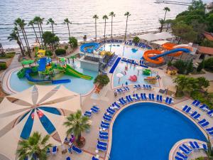 an aerial view of a pool at a water park at Ephesia Holiday Beach Club in Kuşadası