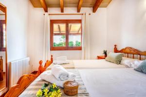 Postel nebo postele na pokoji v ubytování Chalet Turó by dracmallorca