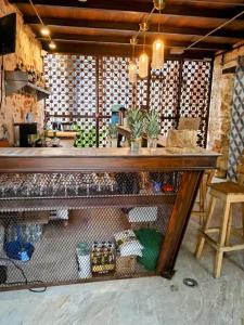 a kitchen with a counter and a table in a room at Habitación privada en Getsemaní in Cartagena de Indias