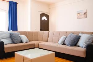 a living room with a couch and a coffee table at Altura House by LovelyStay in Altura