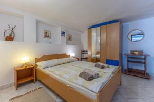 Postel nebo postele na pokoji v ubytování Apartments Dado