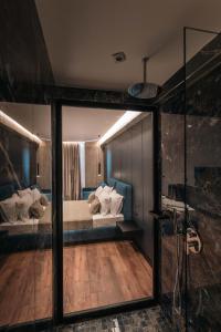 Letto o letti in una camera di Cuni Luxury Hotel
