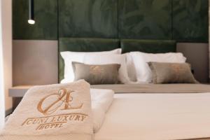 Letto o letti in una camera di Cuni Luxury Hotel