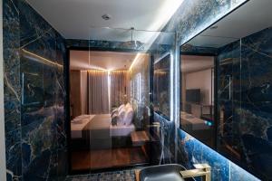 Letto o letti in una camera di Cuni Luxury Hotel