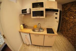 Kuchyňa alebo kuchynka v ubytovaní Apartament Poznań Jeżyce
