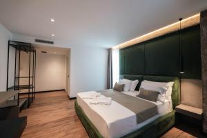 Letto o letti in una camera di Cuni Luxury Hotel