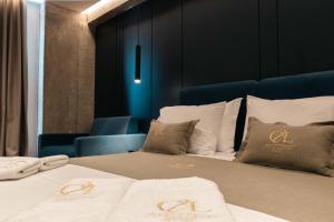 Letto o letti in una camera di Cuni Luxury Hotel