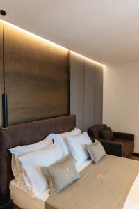 Letto o letti in una camera di Cuni Luxury Hotel