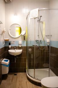 a bathroom with a shower and a sink at Prague Dream Hostel in Prague +58 photos