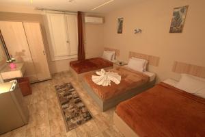 Кровать или кровати в номере City Stars Hotel +9 фотографий