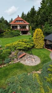 an aerial view of a yard with a house at Family Lake House in Mikołajki +111 photos
