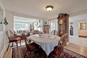 a dining room and living room with a table and chairs at Back Cove - Large Sunny 2 Bedroom Condo in Portland