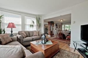 a living room with a couch and a coffee table at Back Cove - Large Sunny 2 Bedroom Condo in Portland