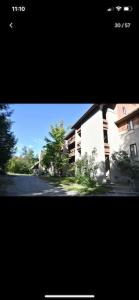 a picture of a street with a building in the background at Summit Haus Golf and Liftside Penthouse in Carrabassett