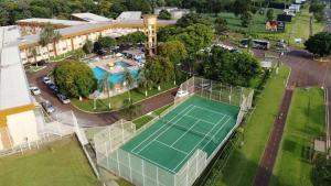 an overhead view of a tennis court in front of a building at Dom Pedro I Palace Hotel in Foz do Iguaçu