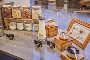 a display of food items on a table at Appart'hôtel Odalys City - Bioparc Lyon Est in Lyon