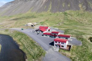 an aerial view of a house with a red roof at Grund í Grundarfirði Economy Guesthouse in Grundarfjordur