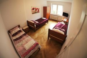 Posteľ alebo postele v izbe v ubytovaní Apartament Poznań Jeżyce