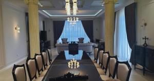 a conference room with a long table and chairs at Buzovna Private Seaside Villa in Baku +29 photos