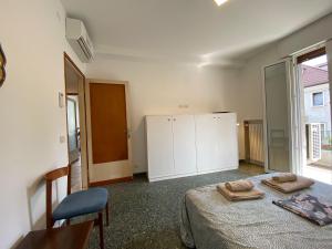 En eller flere senge i et værelse på Ca' Aleardi Apartment