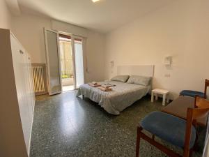 En eller flere senge i et værelse på Ca' Aleardi Apartment