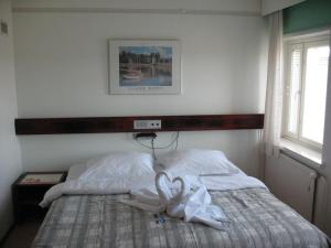 Postel nebo postele na pokoji v ubytování Hotel Kemijärvi