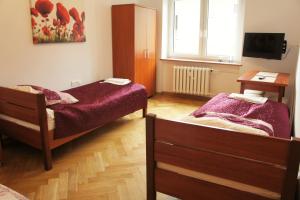 Posteľ alebo postele v izbe v ubytovaní Apartament Poznań Jeżyce