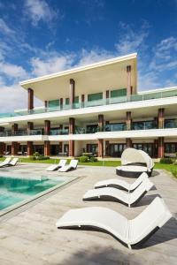 a large building with a swimming pool and an open book at Under the Stars Luxury Apartment in Boracay