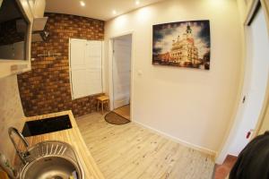 Televízia a/alebo spoločenská miestnosť v ubytovaní Apartament Poznań Jeżyce