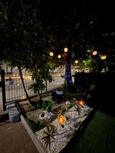 a garden at night with lights and a fence at Ferienzimmer Healing und Montuerwohnung in Weißenfels
