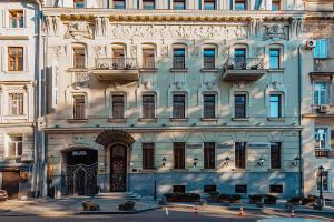 a large building with a large door in front of it at Ribas Duke Boutique Hotel in Odesa