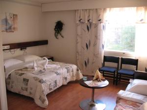Postel nebo postele na pokoji v ubytování Hotel Kemijärvi