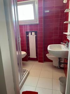 Koupelna v ubytování Elly Casa Vacanze + 13 fotografií