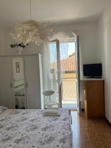 TV a/nebo společenská místnost v ubytování Elly Casa Vacanze