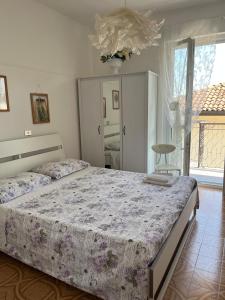 Postel nebo postele na pokoji v ubytování Elly Casa Vacanze