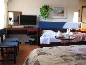 Postel nebo postele na pokoji v ubytování Hotel Kemijärvi
