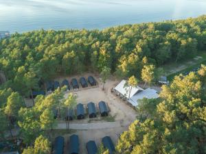 an overhead view of a group of tents and trees at UMILI Ustronie Park - beach resort in Ustronie Morskie