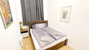 Postel nebo postele na pokoji v ubytování Comfortable rooms in Lugner City area HE