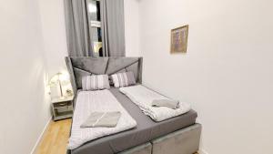 Postel nebo postele na pokoji v ubytování Comfortable rooms in Lugner City area HE