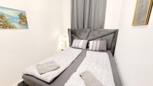 Postel nebo postele na pokoji v ubytování Comfortable rooms in Lugner City area HE