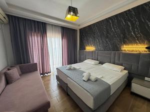 Postel nebo postele na pokoji v ubytování Hotel Pini