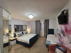 Posteľ alebo postele v izbe v ubytovaní Villa Bose- Apartmani Luka Šodan